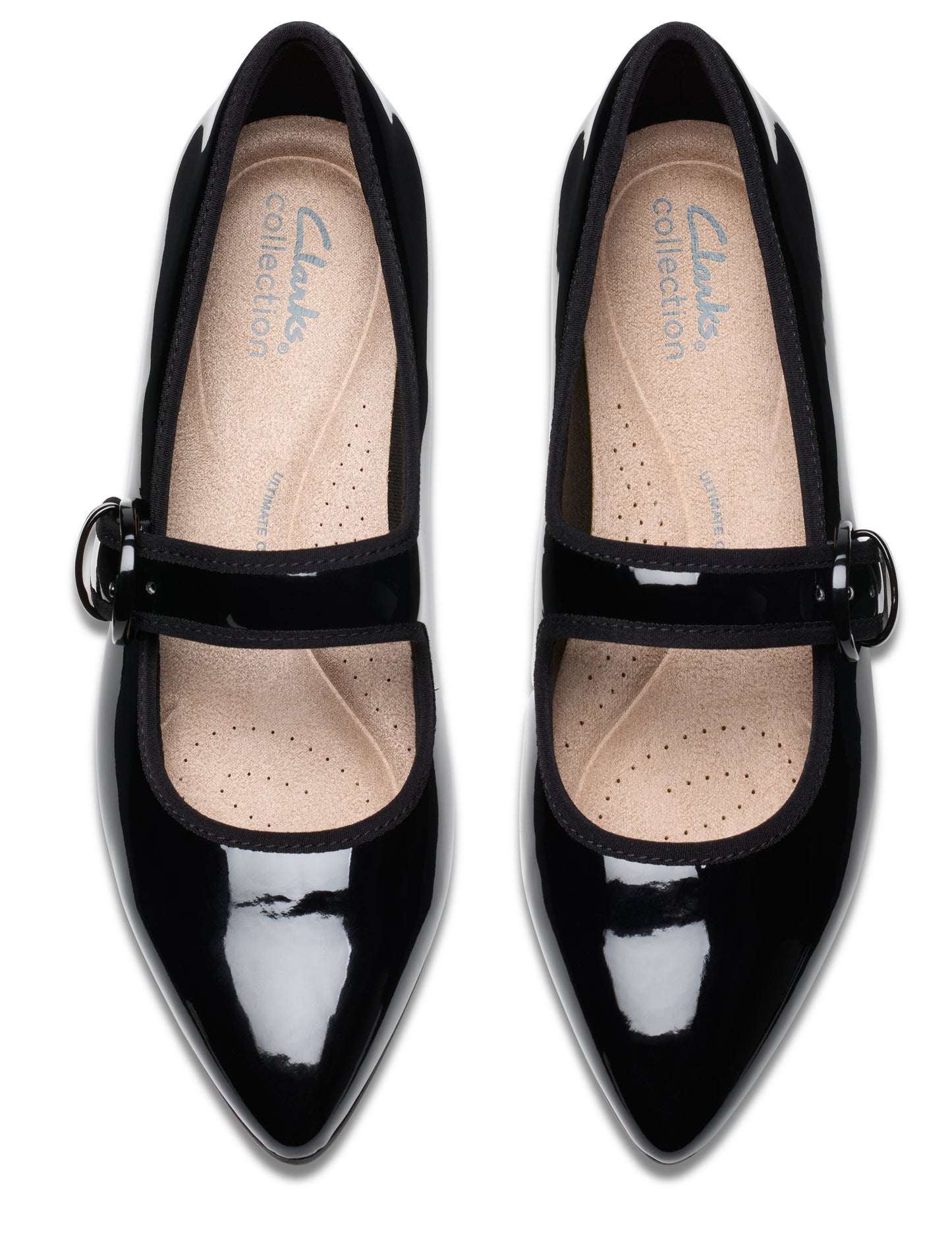 Pair of black patent leather Mary Jane shoes with pointed toe and buckled straps.