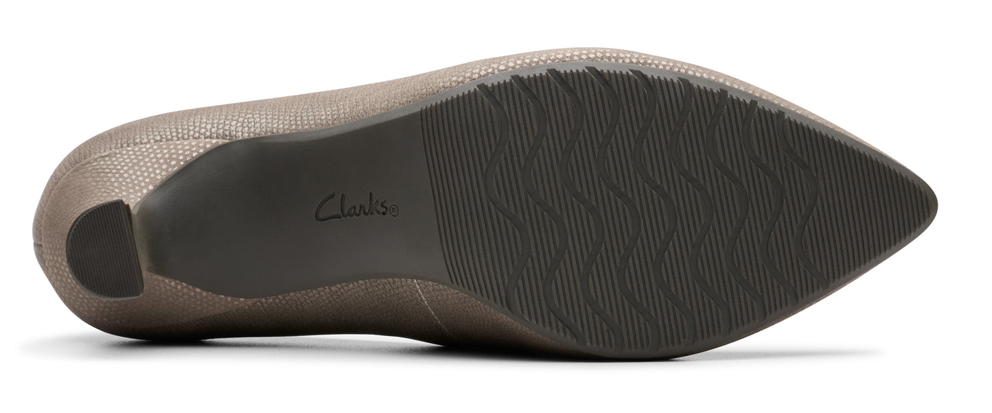 bottom view of a pointy-toe dress shoe with a low heel
