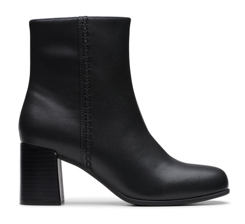 Black ankle boot with block heel and stitched side detail.