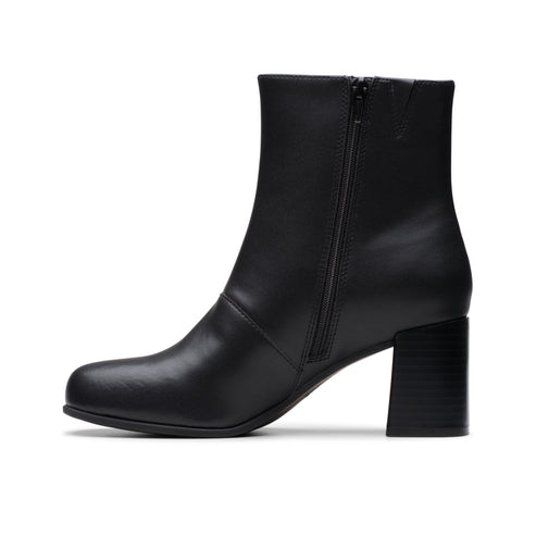 Black ankle boot with block heel and side zipper.