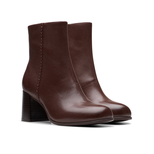Pair of brown leather ankle boots with block heels.