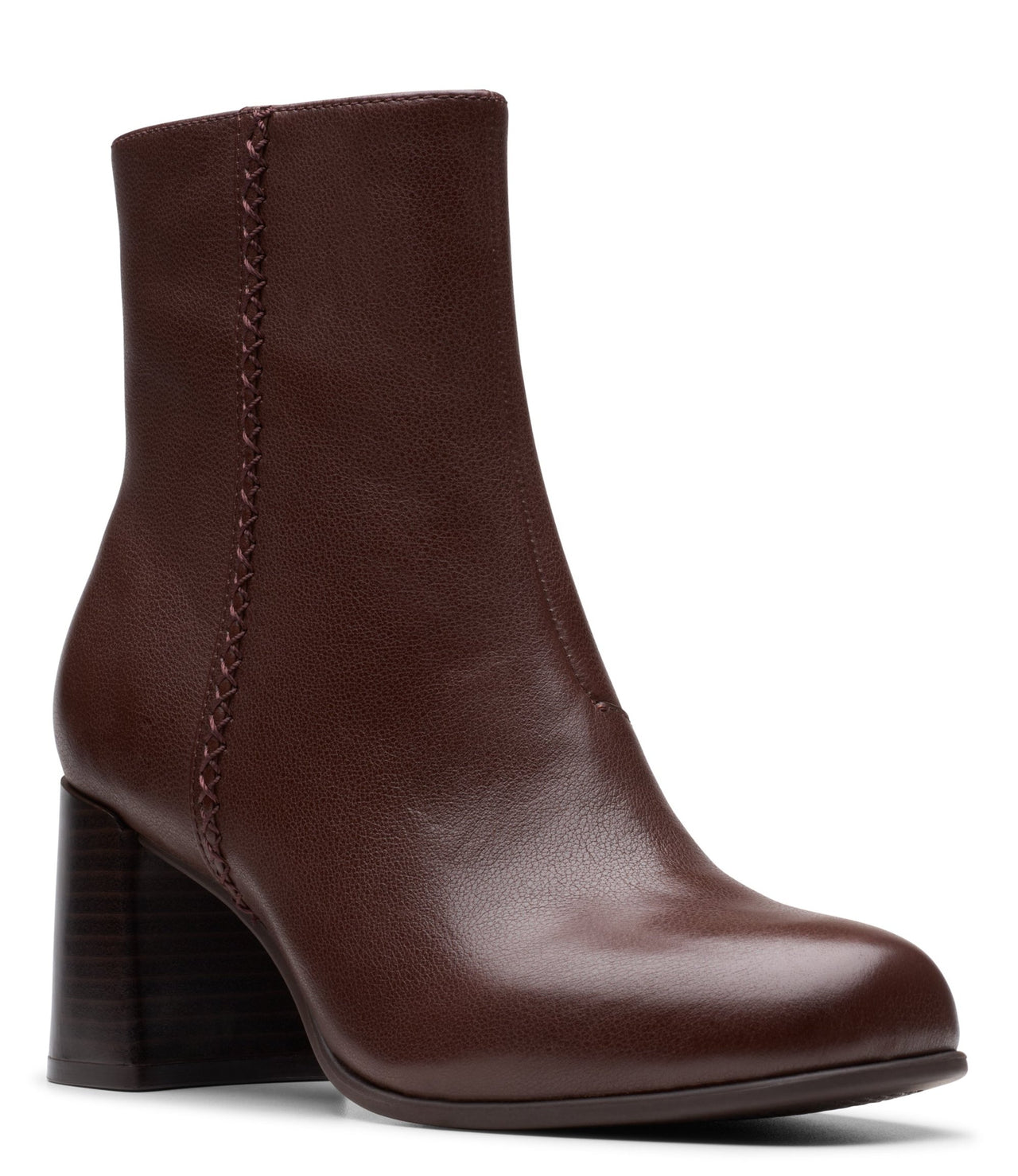 A shiny brown leather ankle boot with a block heel and decorative stitching on the outside ankle.
