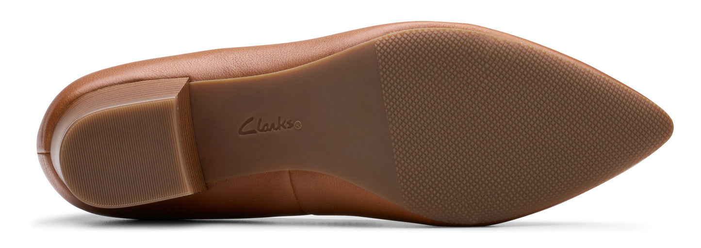 Bottom of a pointed-toe leather dress shoe with a block heel and traction.
