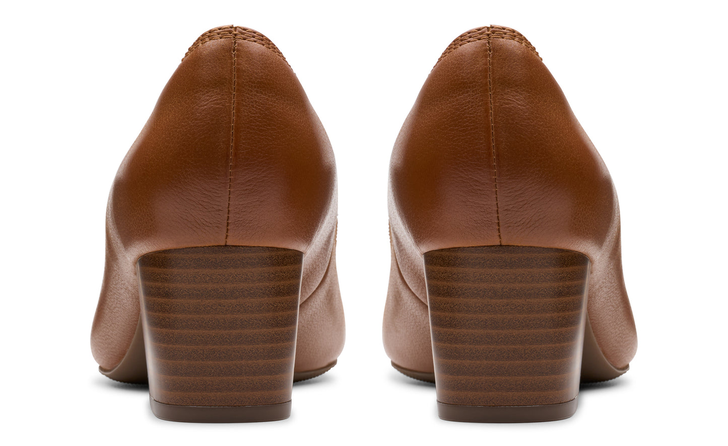 Rear view of two brown leather heeled dress shoes.