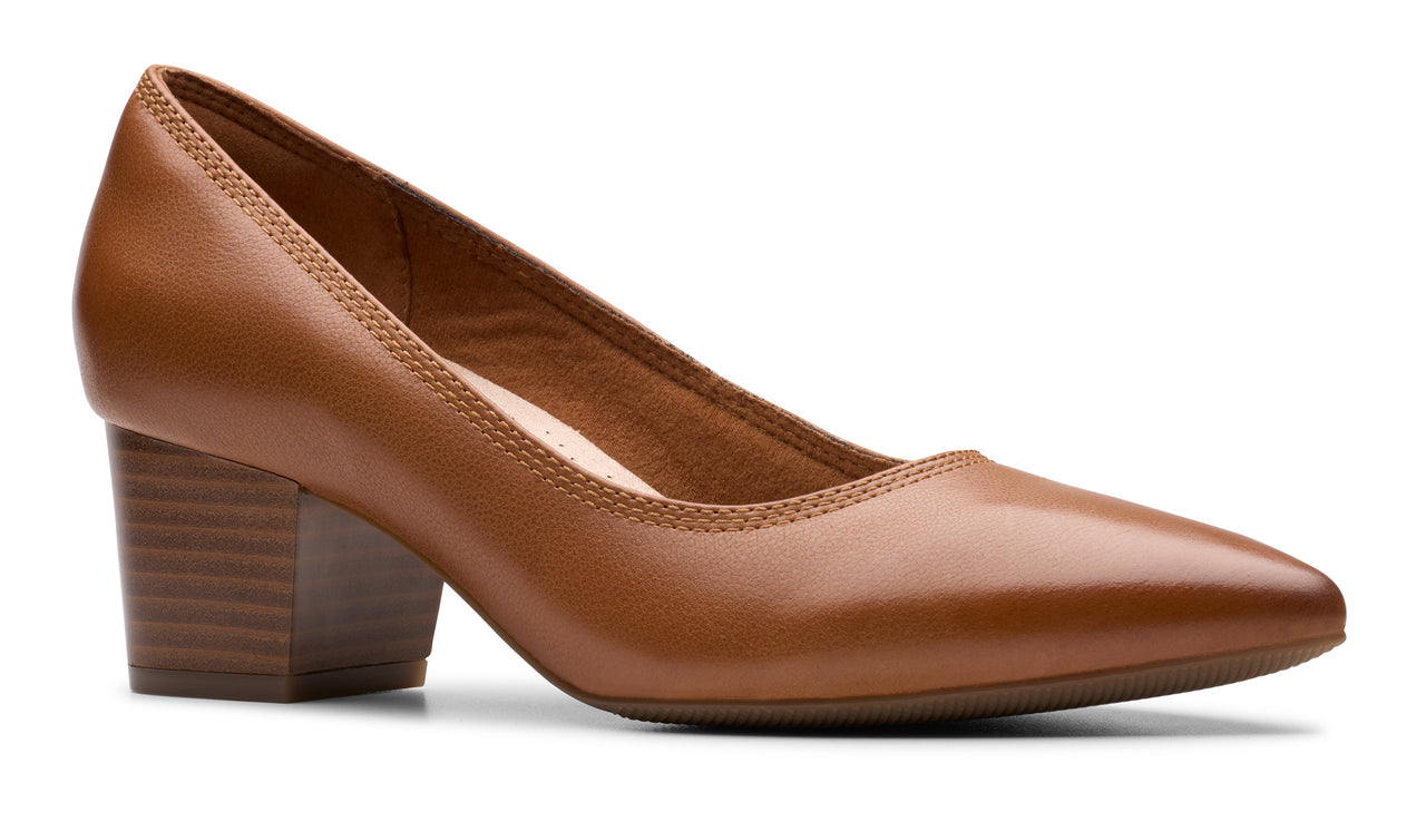 Tan leather pump with a block heel.