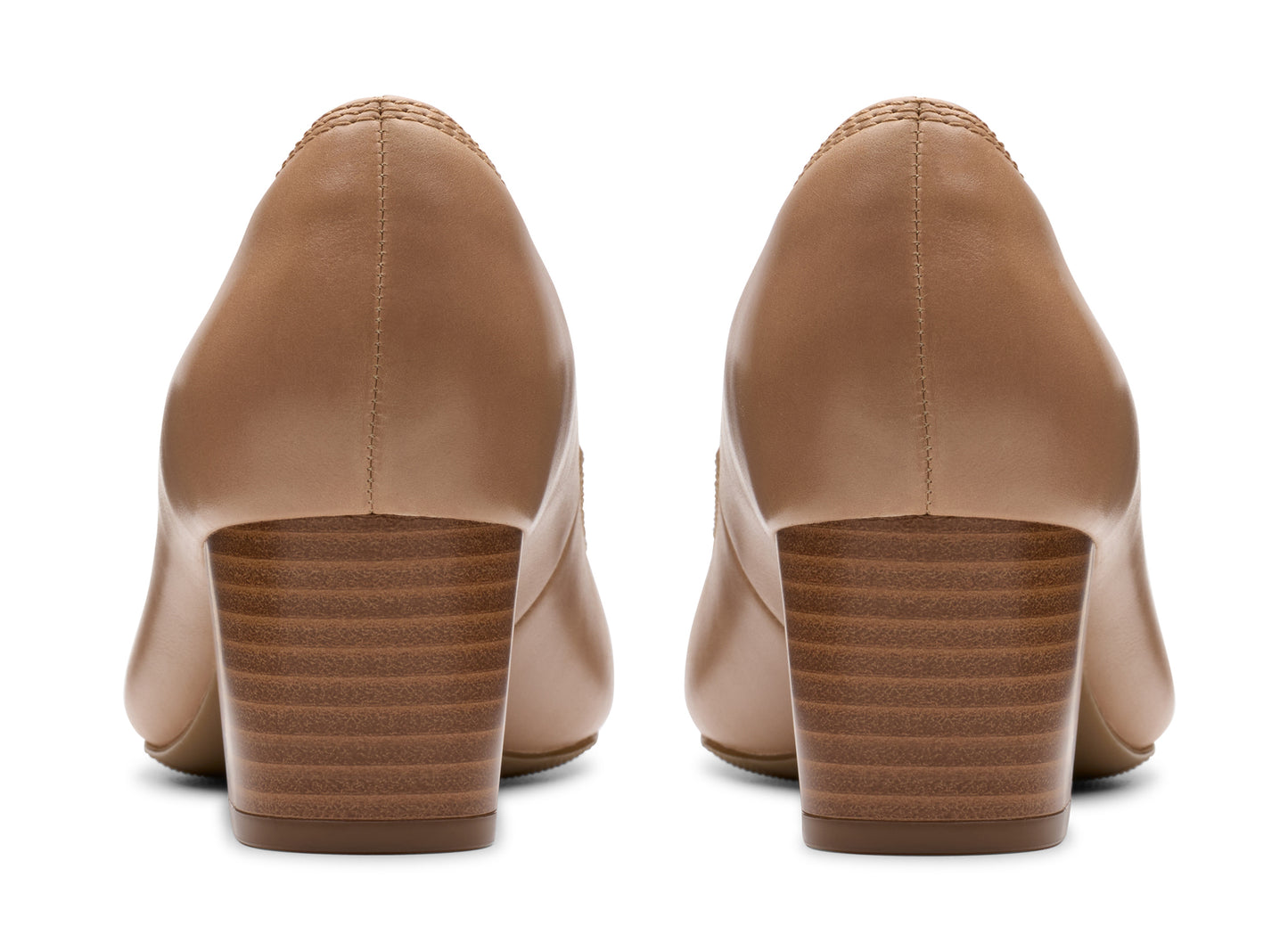 Pair of beige leather heeled pumps with block heels.