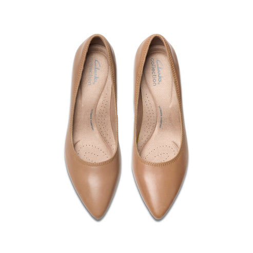 Pair of light-brown, closed-toe, high-heeled dress shoes, top-down view.