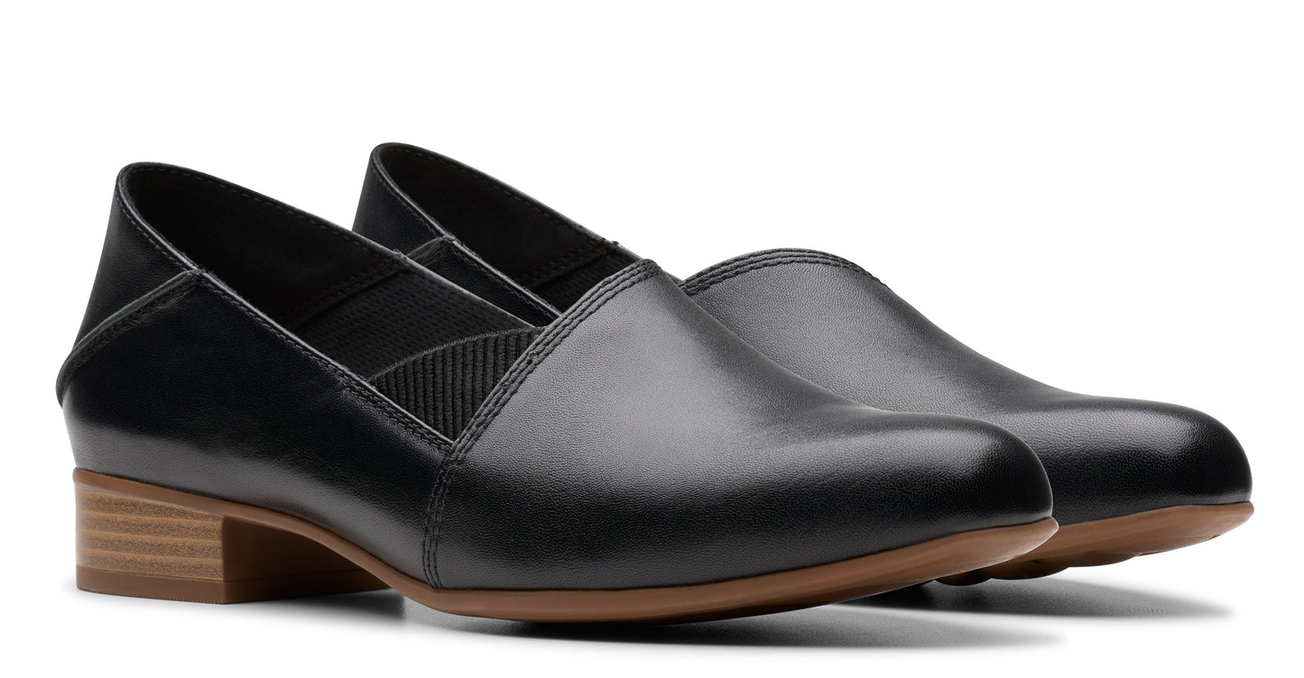 Pair of black leather loafer-style shoes with block heels.