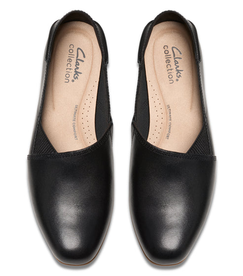 Pair of black leather ballet flats, top view. 'Clarks collection' logo on the inner sole.
