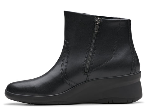 Black leather ankle boot with a wedge heel and side zipper.
