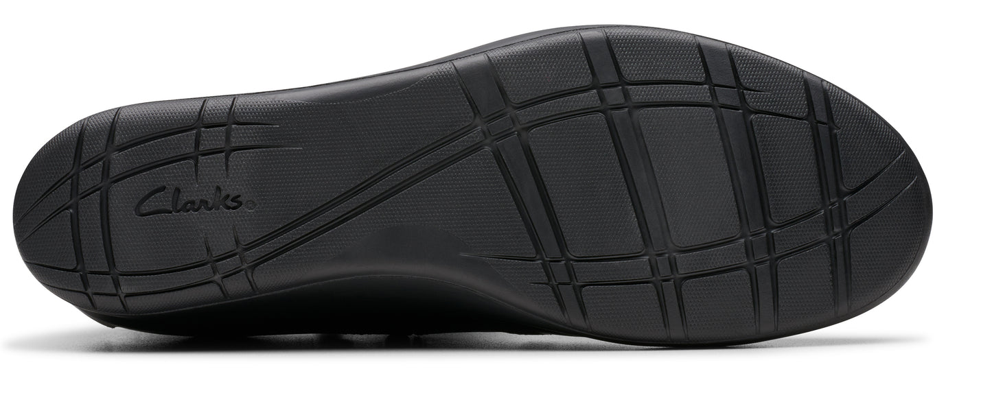 Black shoe sole with textured grip and the word 'Clarks' visible.