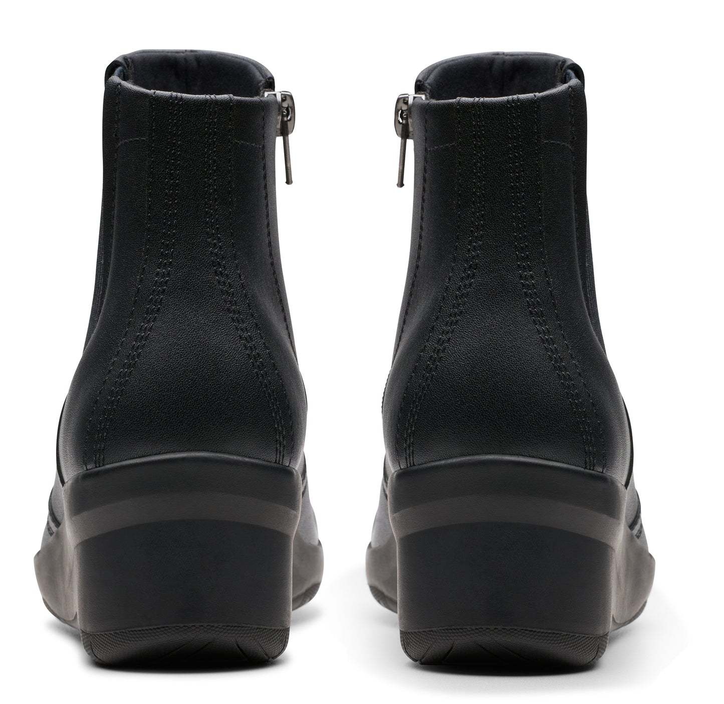 Pair of black ankle boots with zipper.
