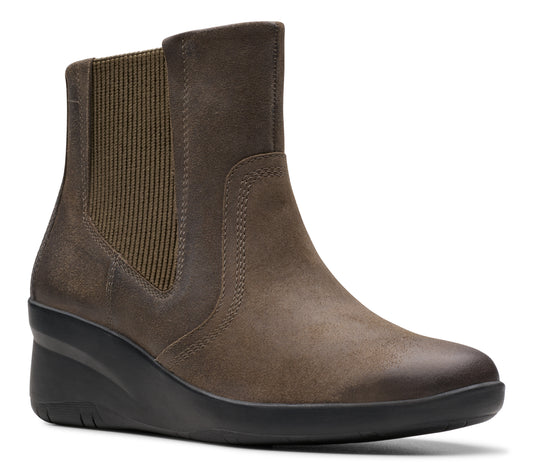 Olive suede ankle boot with elastic side panels and low wedge sole.