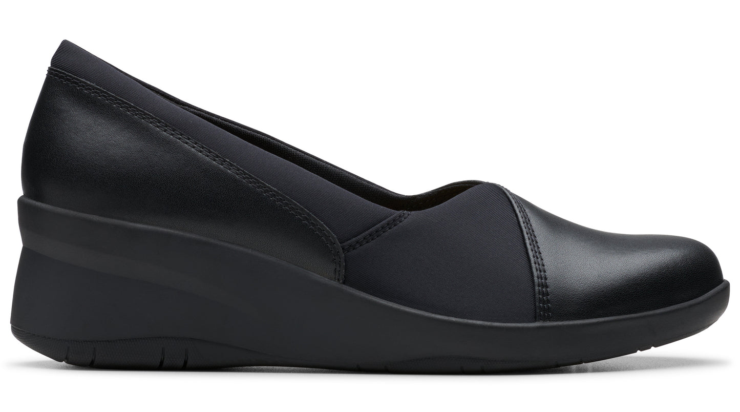 Black wedge shoe, rounded toe, with mixed leather and synthetic fabric.
