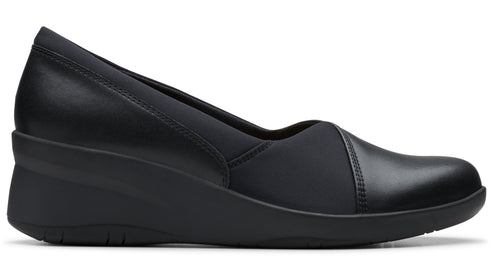 Black wedge shoe, rounded toe, with mixed leather and synthetic fabric.