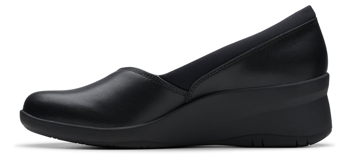A black leather wedge heel dress shoe.