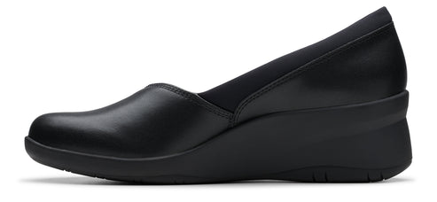 A black leather wedge heel dress shoe.