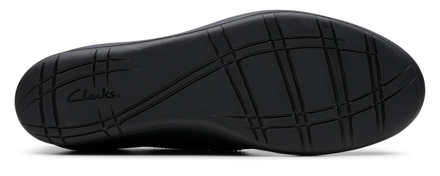 Black shoe sole with patterned treads and the text "Clarks".