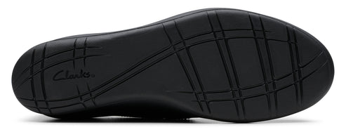 Black shoe sole with patterned treads and the text "Clarks".