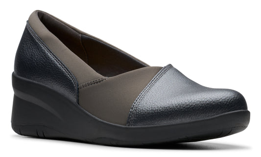 Low wedge shoe with black sole, rounded toe, and gray panels