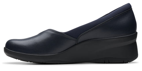 Navy blue wedge shoe with a rounded toe and soft fabric around the foot opening.