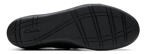 Sole of a shoe with intersecting grooves.
