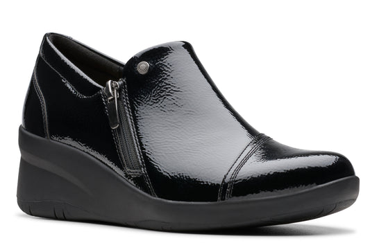 Black shiny wedge shoe with a side zipper.