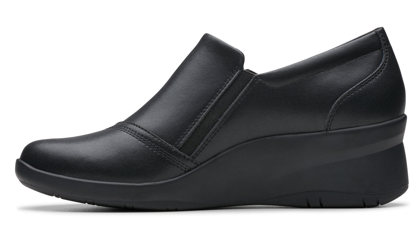 Black wedge shoe with smooth leather upper and elastic side goring.