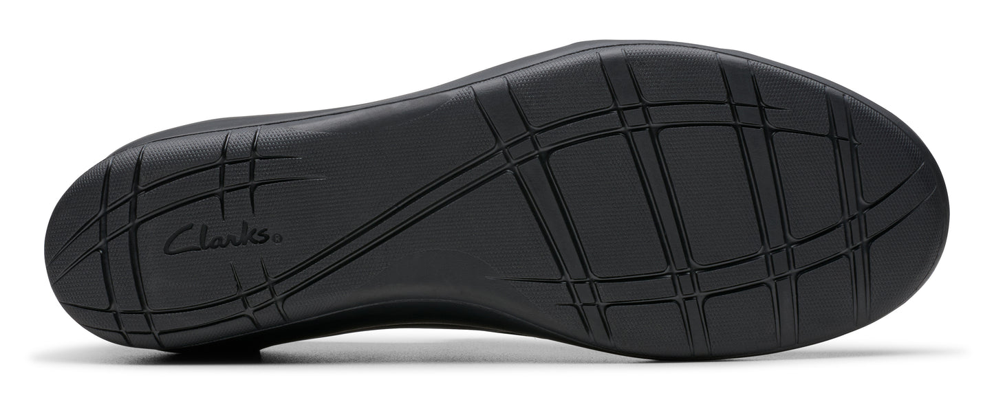 Bottom of a shoe with a textured black rubber sole and the "Clarks" brand name.
