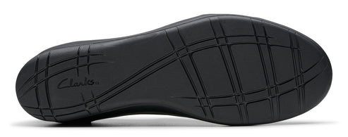 Bottom of a shoe with a textured black rubber sole and the "Clarks" brand name.