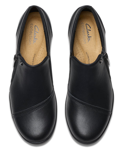 Overhead view of two black leather Clarks Collection women's loafers with a side zipper.