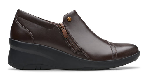 Brown leather wedge shoe with a side zipper.