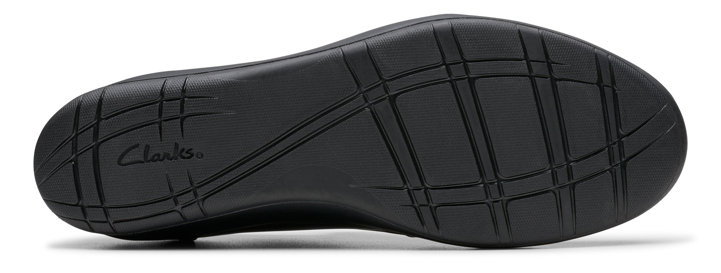 Black shoe sole with tread and the visible text "Clarks".