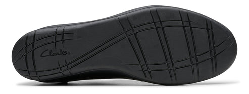 Black shoe sole with tread and the visible text "Clarks".