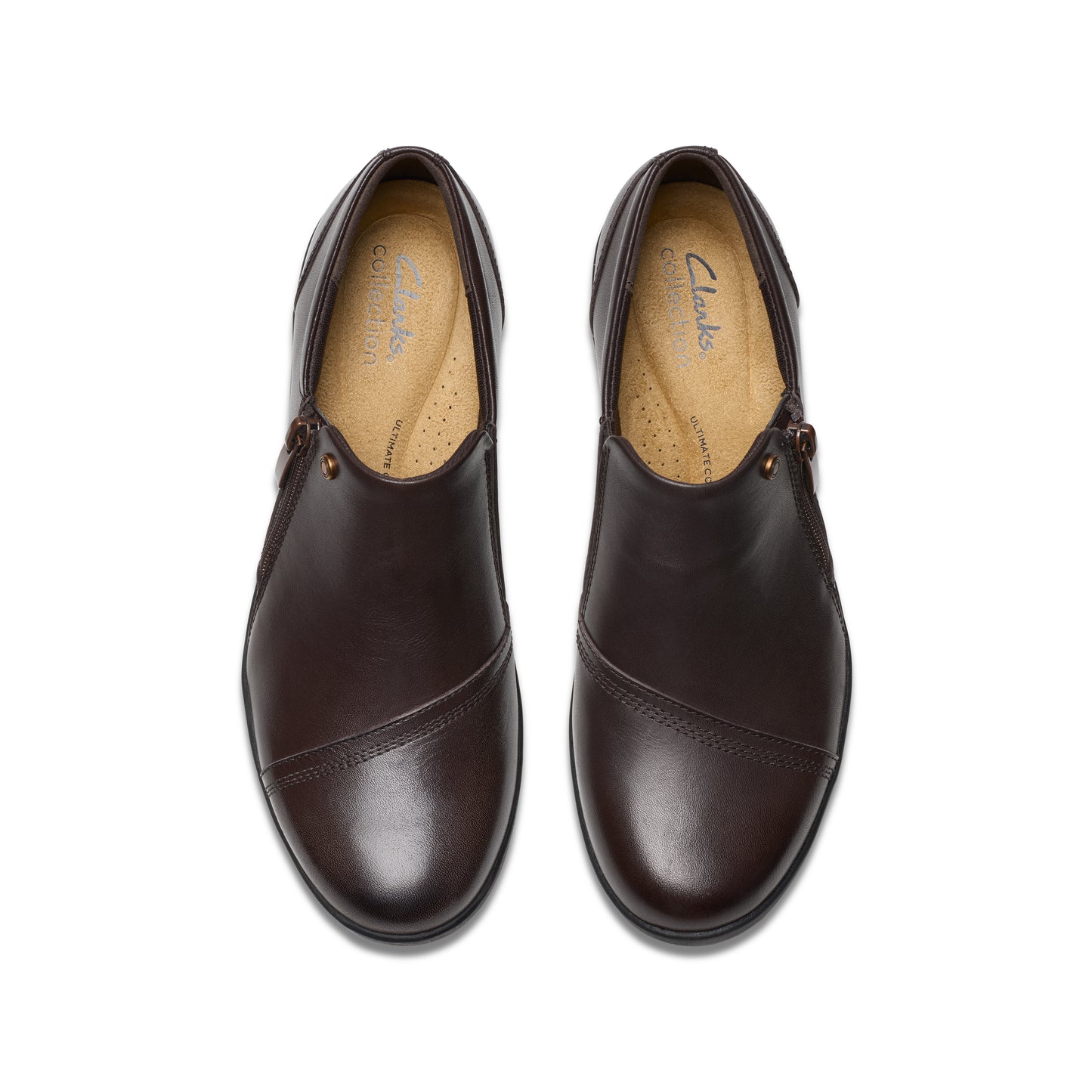 Pair of brown leather slip-on dress shoes, top view.