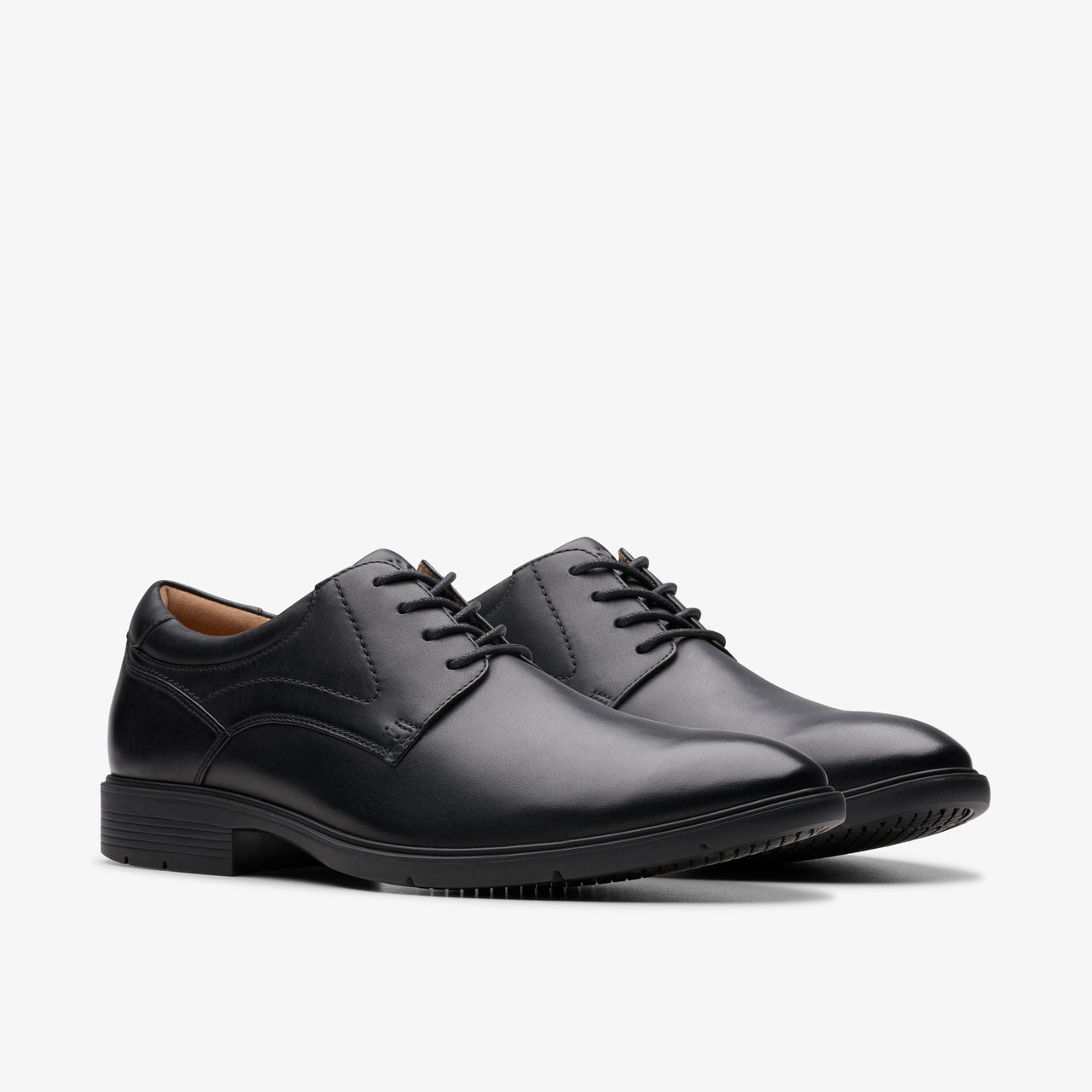 Two black leather dress shoes, laced.