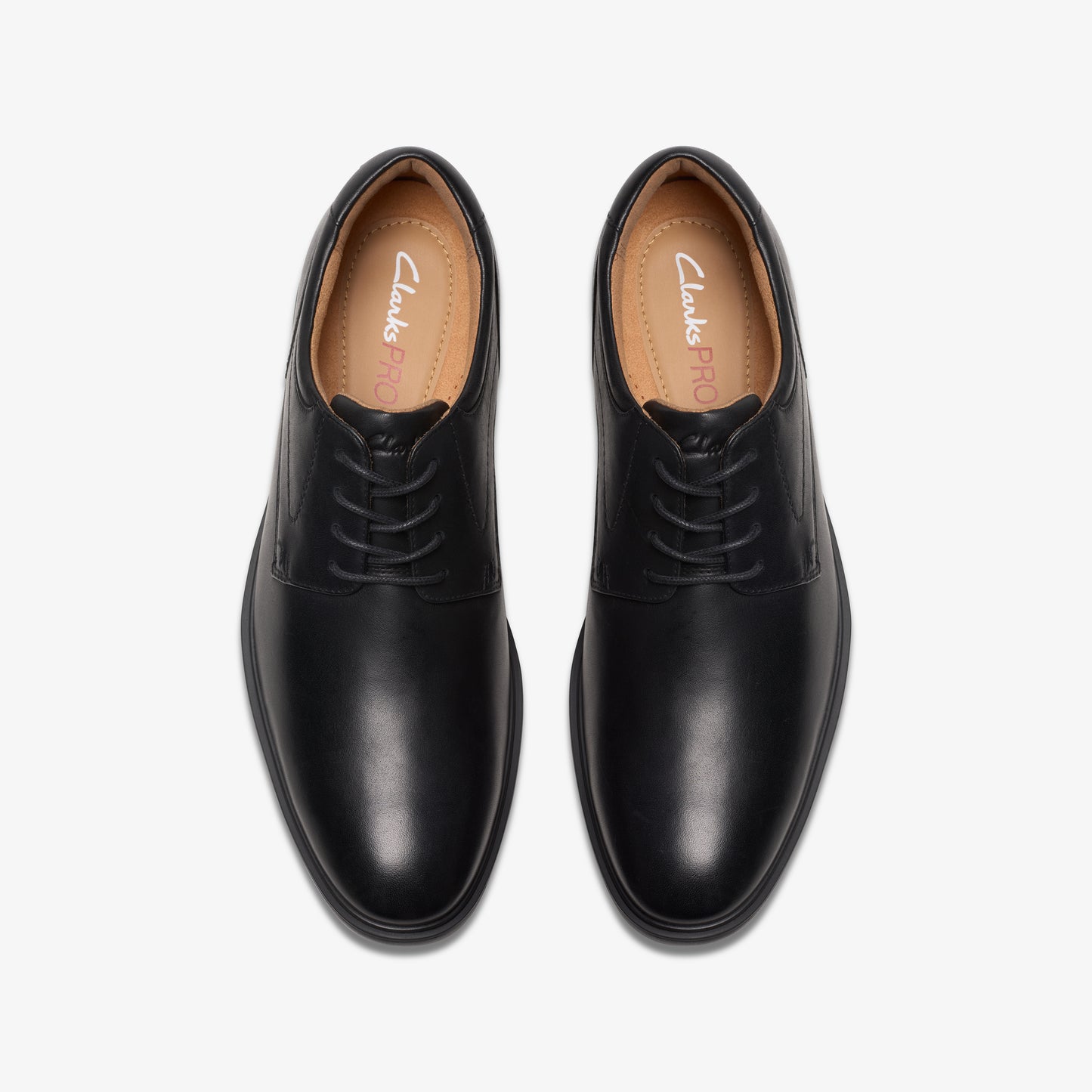 Pair of black leather dress shoes with laces.