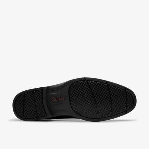 Black shoe sole with a grid pattern and 'Clarks' logo.