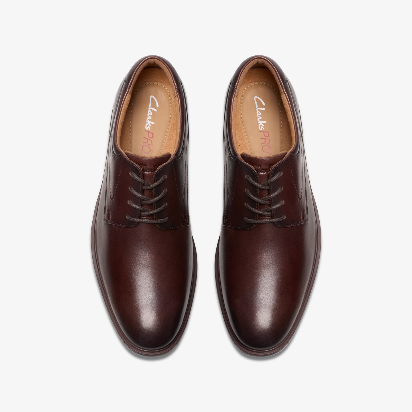 Pair of brown leather dress shoes with laces.