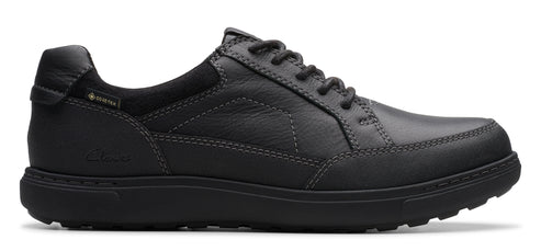 A dark gray, low-cut leather shoe with dark gray laces.