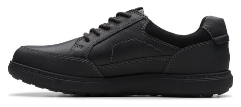 A black leather shoe with black laces.
