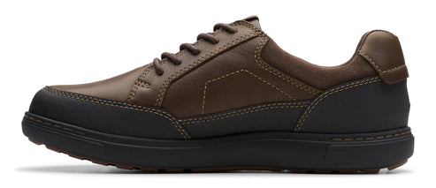 A brown leather shoe with black soles and laces.