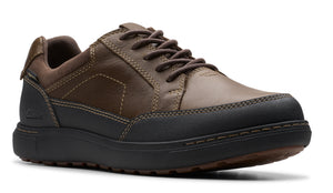 A brown leather lace-up shoe with a black rubber sole.