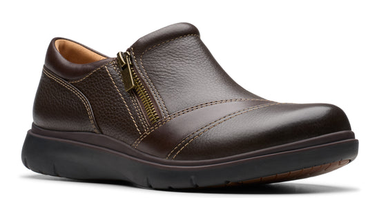 Dark brown leather slip-on shoe with side zipper and thick black sole.
