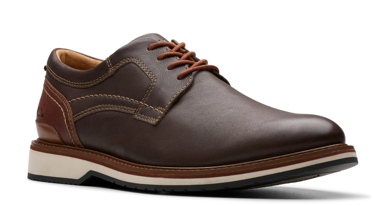Dark brown leather dress shoe with brown laces and white/brown sole.