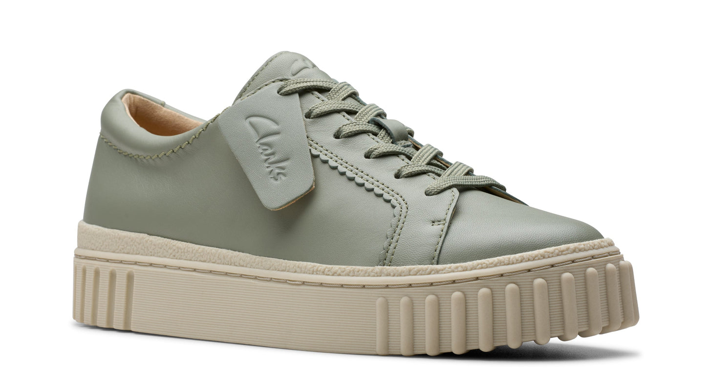 Light green leather sneaker with thick, ridged off-white sole and laces.