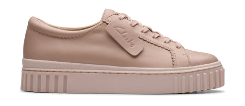 A low-top leather sneaker with a thick sole.