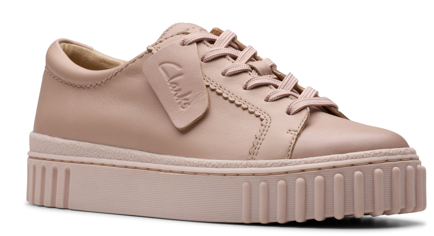 Low-top pink leather sneaker with a thick platform sole and laces.