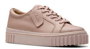 Low-top pink leather sneaker with a thick platform sole and laces.