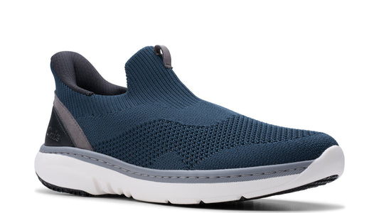 Slip-on style shoe with a blue, knitted upper, gray lining and a white sole.